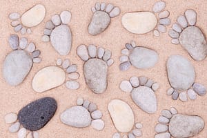 Pebble footprints illustrating that every flat foot is unique.