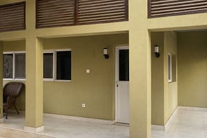 Shaded courtyard leading to the physiotherapy treatment rooms